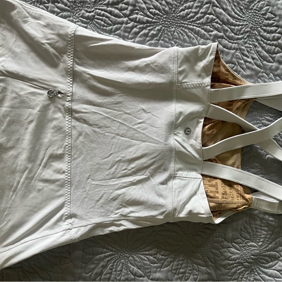 Lululemon white athletic top with detailing and pocket in the back. - Picture 2 of 4